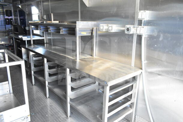 Rock Solid Cargo 8.5'x28' food trailer shell with stainless steel counters, shelves, and CaptiveAire grease hood. Ready for outfitting.