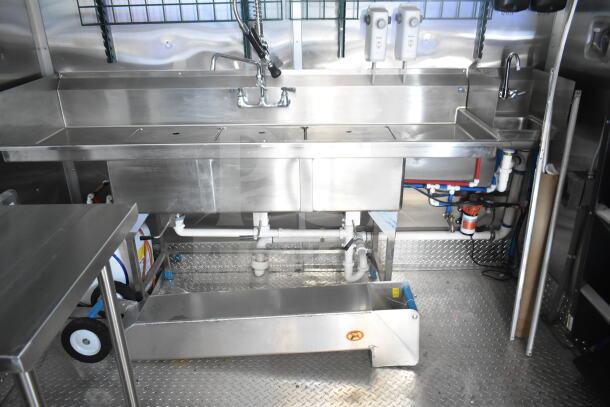 Rock Solid Cargo 8.5'x28' food trailer shell interior, featuring stainless steel sink setup, ready for equipment installation.