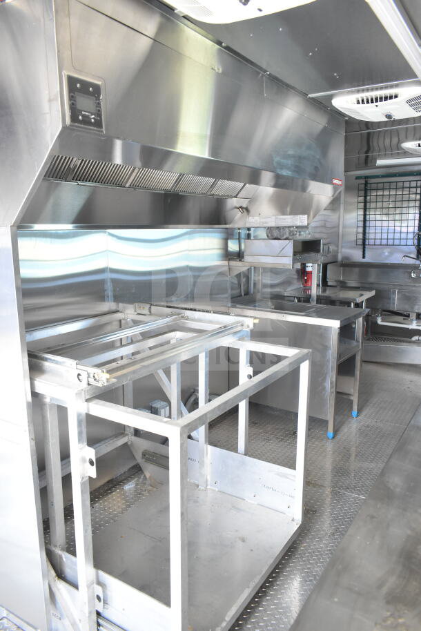 Rock Solid Cargo 8.5'x28' food trailer shell, features CaptiveAire grease hood, ready for kitchen installation. VIN: 7H2BE2837ND041749.