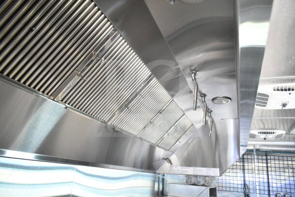 Rock Solid Cargo 8.5'x28' food trailer shell, features CaptiveAire grease hood, ready for equipment installation.