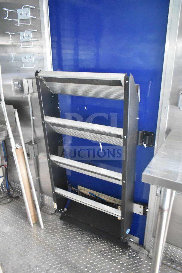 Rock Solid Cargo 8.5'x28' food trailer interior with CaptiveAire grease hood, ready for equipment outfitting.