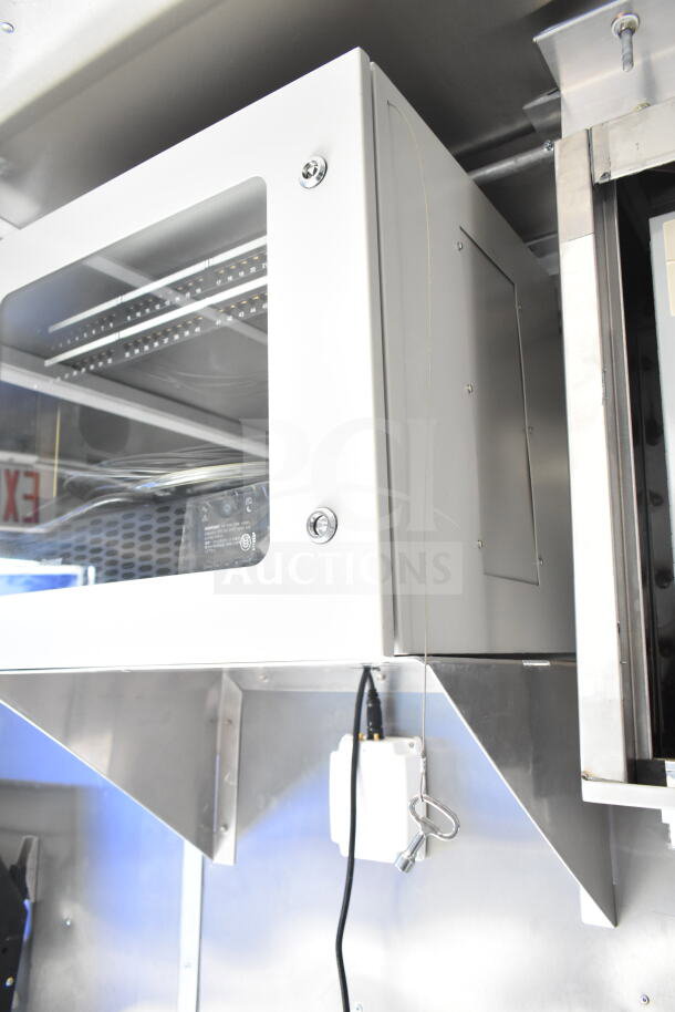 Rock Solid Cargo 8.5'x28' food trailer shell interior with CaptiveAire grease hood, ready for equipment installation, VIN: 7H2BE2837ND041749.