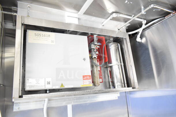 Rock Solid Cargo 8.5'x28' food trailer interior with CaptiveAire grease hood, ready for custom equipment installation.