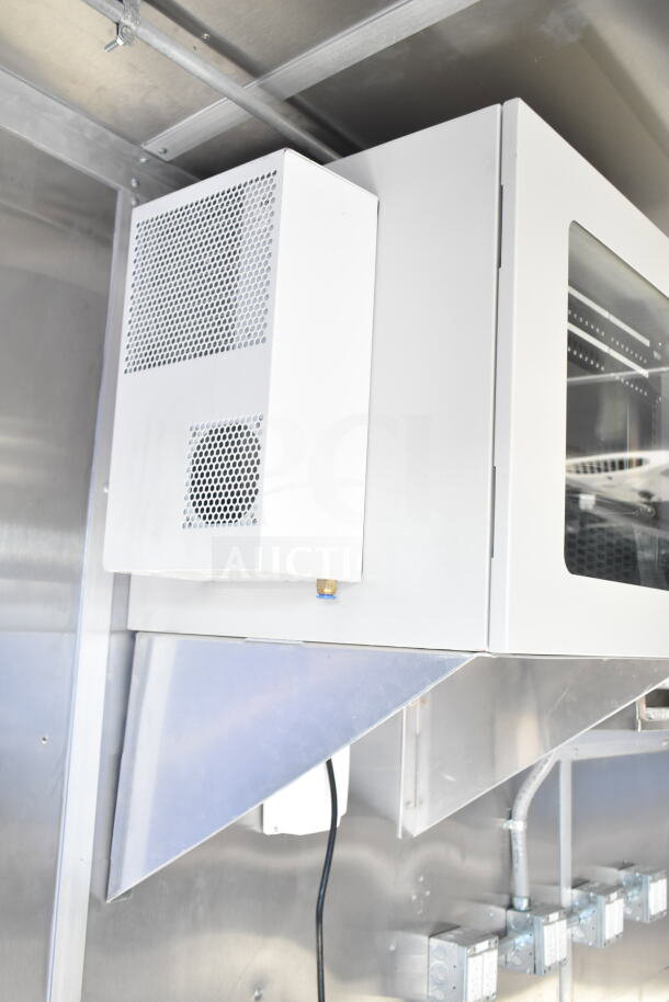 Rock Solid Cargo 8.5'x28' food trailer interior featuring CaptiveAire grease hood. Ready for equipment installation.