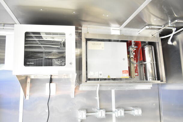 Rock Solid Cargo 8.5'x28' food trailer interior featuring CaptiveAire grease hood and CyberPower unit, ready for customization.