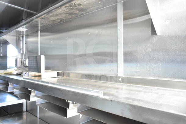 Rock Solid Cargo 8.5'x28' food trailer shell interior featuring CaptiveAire grease hood, ready for equipment installation.