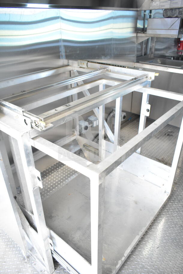Rock Solid Cargo 8.5'x28' food trailer shell interior with CaptiveAire grease hood. Ready for custom outfitting.