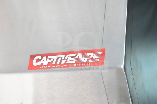 CaptiveAire grease hood in a Rock Solid Cargo 8.5'x28' food trailer shell, ready for custom outfitting.