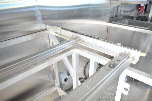 Rock Solid Cargo 8.5'x28' food trailer shell interior, featuring CaptiveAire grease hood. Ready for customization.