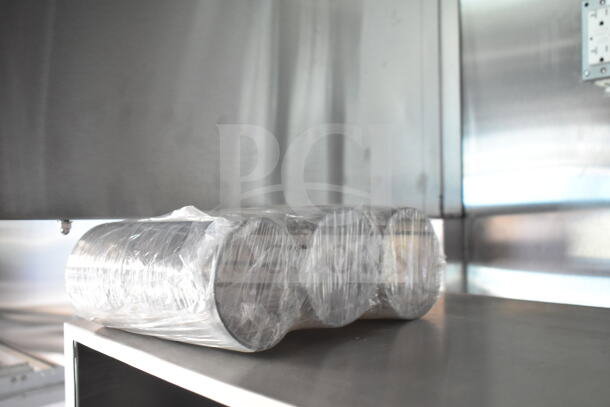 Rock Solid Cargo 8.5'x28' food trailer interior showing CaptiveAire grease hood. Ready for equipment installation.