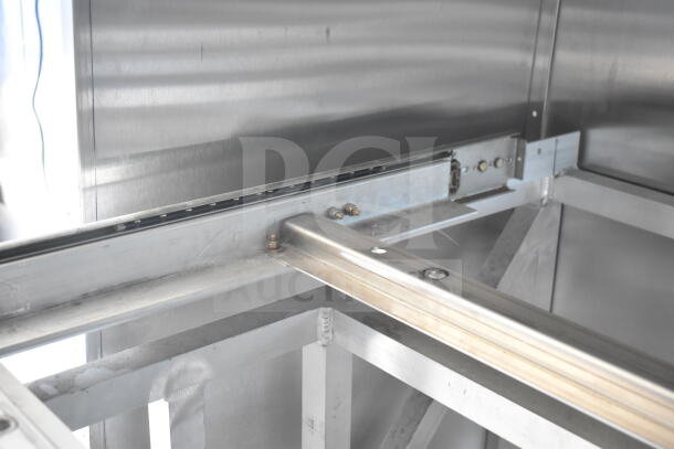 Rock Solid Cargo 8.5'x28' food trailer shell interior showing sturdy metal framework, ready for customization.