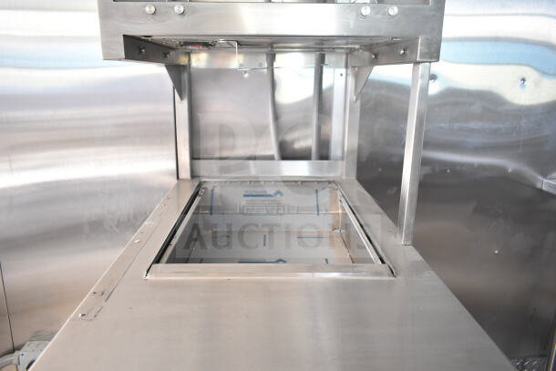 Rock Solid Cargo 8.5'x28' food trailer shell interior showing CaptiveAire grease hood, ready for customization.