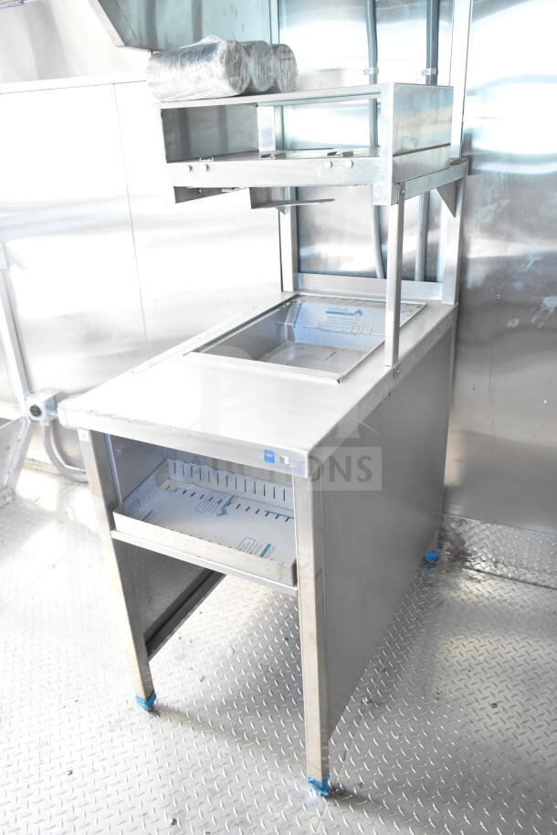 Rock Solid Cargo 8.5'x28' food trailer shell with CaptiveAire grease hood, ready for custom outfitting. New condition.