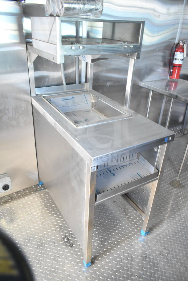 Rock Solid Cargo food trailer shell, 8.5'x28', featuring CaptiveAire grease hood, ready for equipment installation.