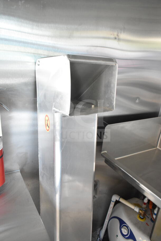 Rock Solid Cargo 8.5'x28' food trailer shell interior, featuring a CaptiveAire grease hood. Ready for equipment installation.