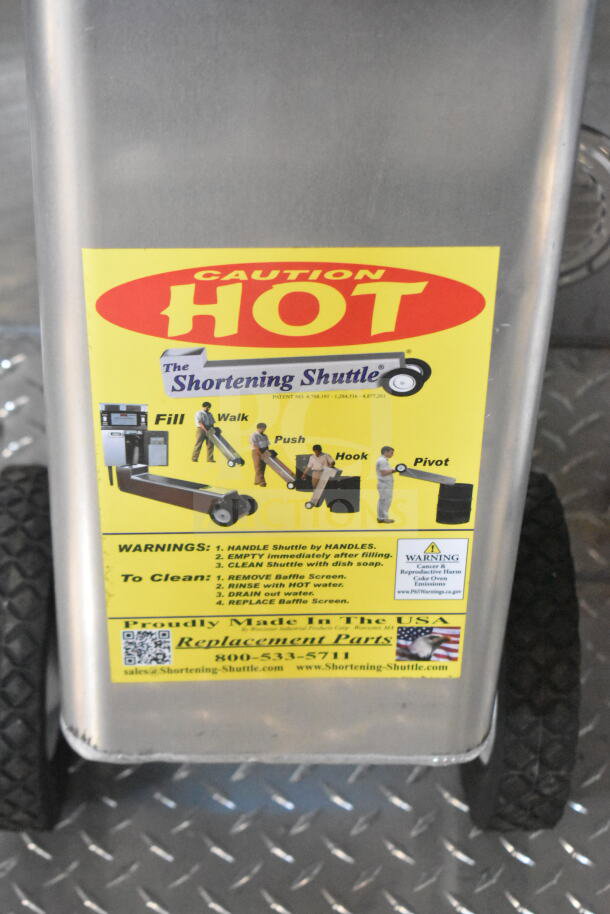 Rock Solid Cargo 8.5'x28' food trailer shell with CaptiveAire grease hood. "Caution Hot" label displayed on a side panel.