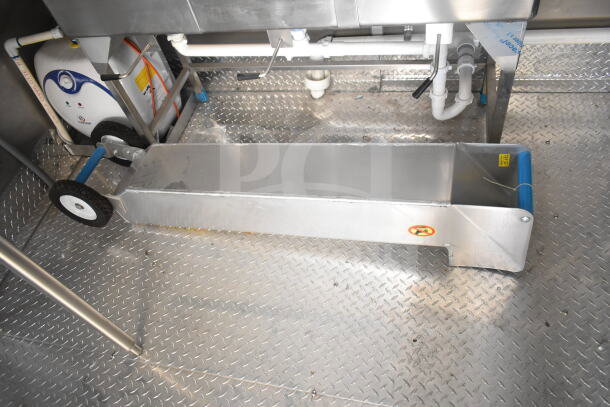 Rock Solid Cargo food trailer interior with CaptiveAire grease hood, diamond plate flooring, plumbing, and equipment fixtures.