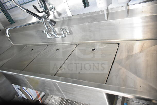 Rock Solid Cargo 8.5'x28' food trailer shell with stainless steel sink area and CaptiveAire grease hood, ready for outfitting. VIN: 7H2BE2837ND041749.