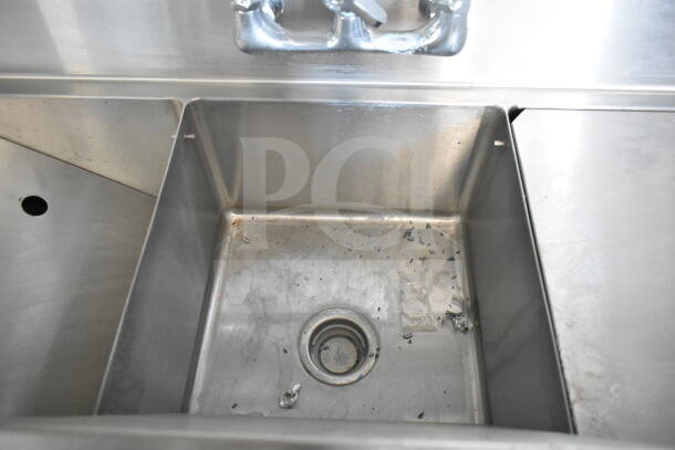 Stainless steel sink inside the Rock Solid Cargo 8.5'x28' food trailer shell, showing light wear.