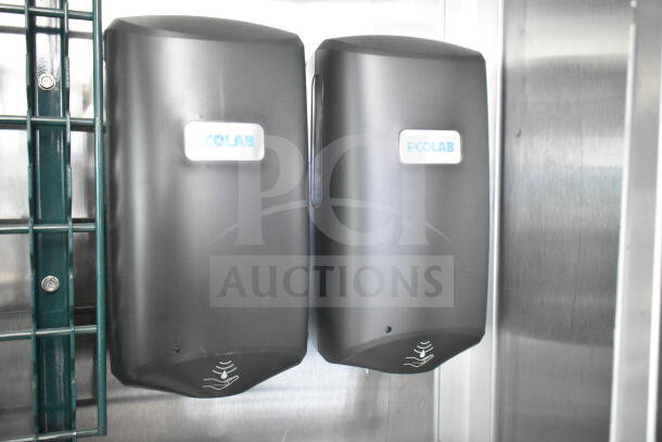 Ecolab dispensers mounted in a stainless steel interior, part of a Rock Solid Cargo 8.5'x28' food trailer shell.