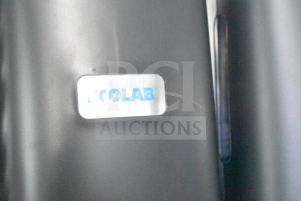 Rock Solid Cargo 8.5'x28' food trailer shell with CaptiveAire grease hood, ready for customization. Features Ecolab label.