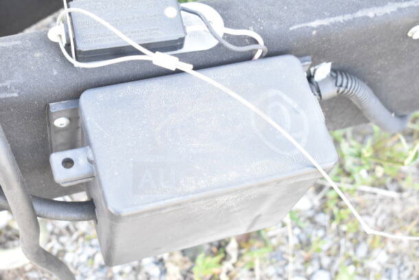 Black electrical box on Rock Solid Cargo food trailer shell, featuring wiring and connector components.