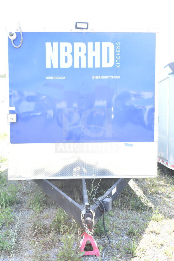 Rock Solid Cargo 8.5'x28' food trailer shell with CaptiveAire grease hood, ready for equipment installation.