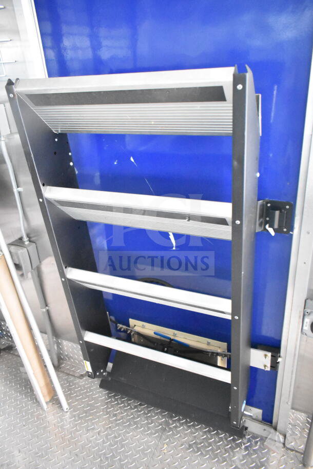Rock Solid Cargo 8.5'x28' food trailer shell with CaptiveAire grease hood, metal interior, ready for customization.