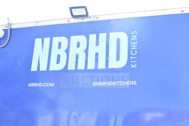 Rock Solid Cargo 8.5'x28' food trailer shell with CaptiveAire grease hood, ready for customization. Visible: NBRHD branding.