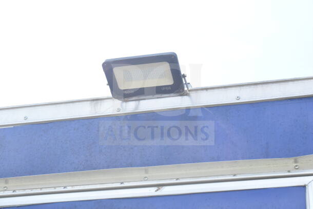 Rock Solid Cargo 8.5'x28' food trailer with CaptiveAire grease hood, ready for customization. VIN: 7H2BE2837ND041749.