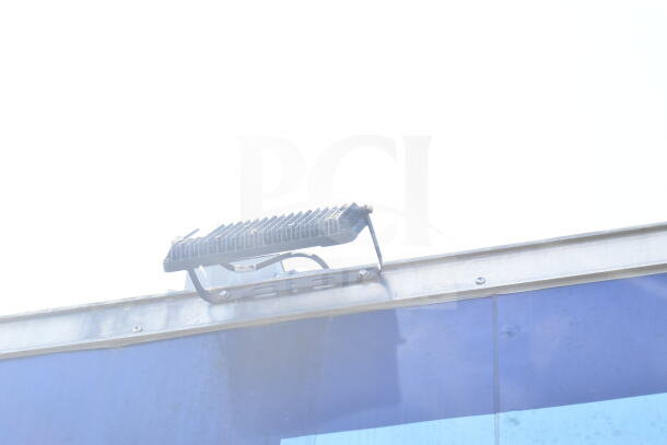 Rock Solid Cargo 8.5'x28' food trailer shell with CaptiveAire grease hood, ready for equipment installation.