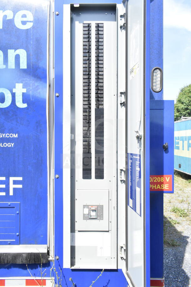 Rock Solid Cargo 8.5'x28' food trailer shell with CaptiveAire grease hood. Electric panel visible. Ready for equipment installation.