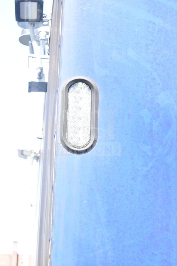 Rock Solid Cargo 8.5'x28' food trailer shell, blue exterior, CaptiveAire grease hood, ready for customization.