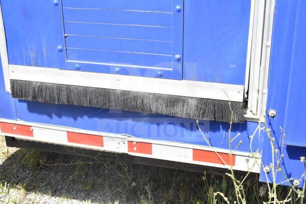 Rock Solid Cargo 8.5'x28' food trailer shell, blue exterior, equipped with CaptiveAire grease hood, ready for customization.