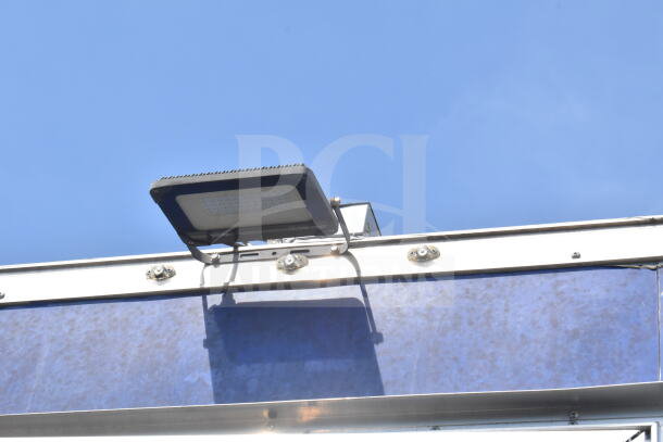Rock Solid Cargo 8.5'x28' food trailer shell, rooftop detail with LED light, equipped with CaptiveAire grease hood, VIN 7H2BE2837ND041749.