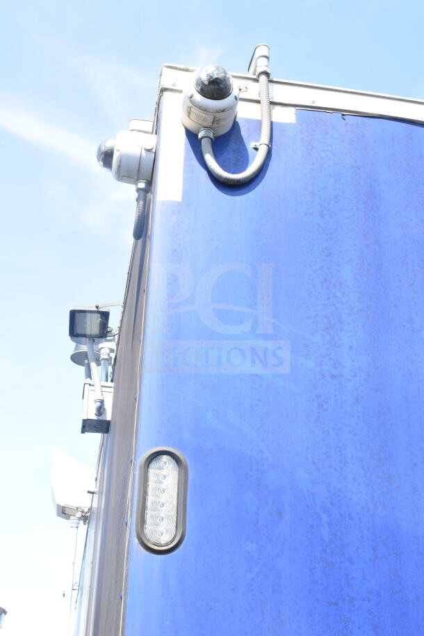 Rock Solid Cargo 8.5'x28' food trailer featuring CaptiveAire grease hood, blue exterior, ready for equipment installation. VIN: 7H2BE2837ND041749.