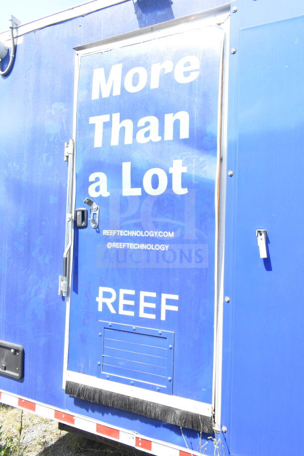 Rock Solid Cargo 8.5'x28' food trailer shell, blue exterior, features CaptiveAire grease hood, ready for custom outfitting.