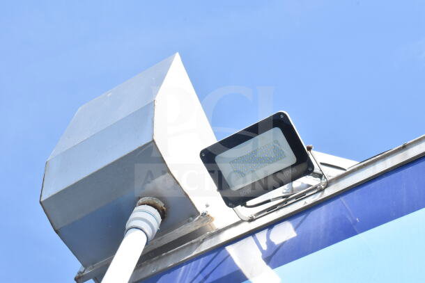 Exterior view of a Rock Solid Cargo 8.5'x28' food trailer shell featuring a CaptiveAire grease hood. Ready to customize.