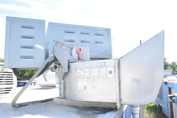 Rock Solid Cargo 8.5'x28' food trailer shell with CaptiveAire grease hood, ready for customization. VIN: 7H2BE2837ND041749.