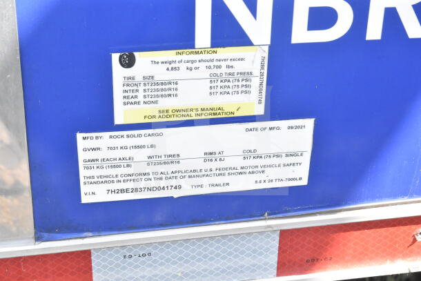 Rock Solid Cargo 8.5'x28' food trailer label, includes tire size and pressure, GVWR 7031 kg, VIN 7H2BE2837ND041749.