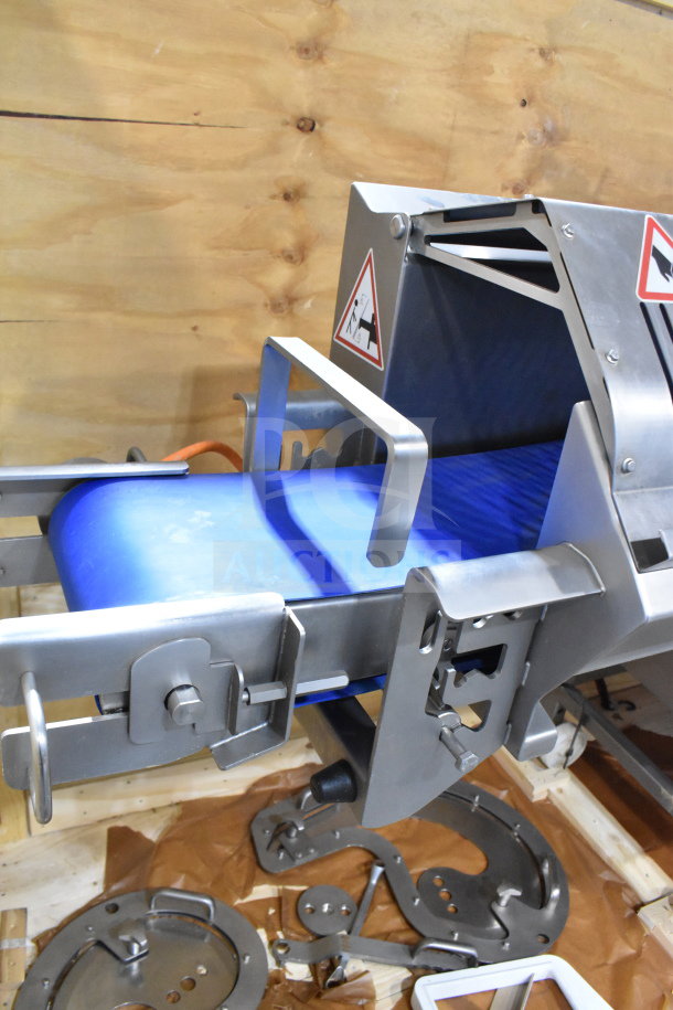 Treif Puma horizontal slicer on commercial casters, stainless steel, blue conveyor, safety labels, disassembled components shown.