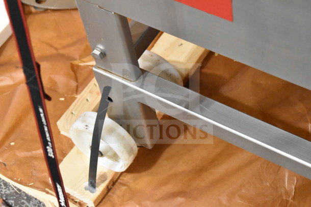 Treif Puma Horizontal Slicer on commercial casters, stainless steel frame, visible wheels, sturdy design.