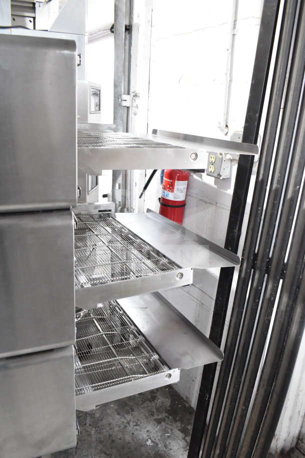 Turbochef HCW2620 Commercial Electric Conveyor Oven on casters, shown with stainless steel conveyor racks. 208/240 Volts, 3 Phase.