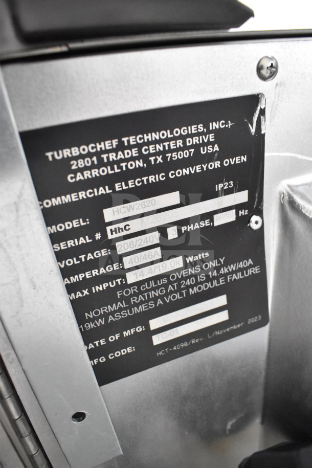 Turbochef HCW2620 commercial electric conveyor oven label showing model, serial number, and voltage details.