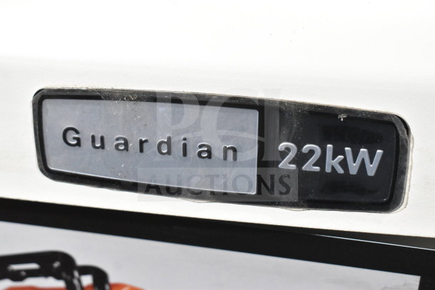 Generac Guardian 22kW standby generator label showing brand and power output.
