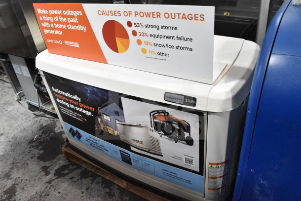 Generac Guardian 22kW standby generator, natural gas-powered, with promotional signs, in good condition.