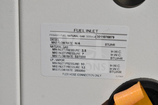 Generac Guardian 22kW standby generator, natural gas, showing fuel inlet label; serial number 3011076879, good condition.