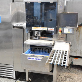Mettler Toledo 880 Auto wrapping machine, commercial floor style, automatic, 200-240V, stainless steel finish, digital display.