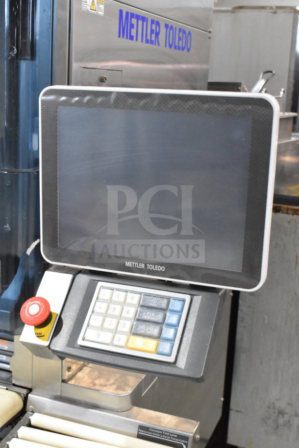 Mettler Toledo 880 Auto commercial wrapping machine, features a touchscreen, label indicating 200-240 volts, in good condition.