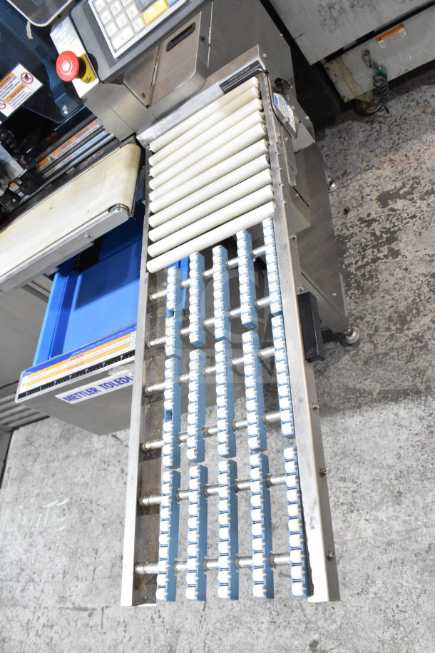 Mettler Toledo 880 Auto commercial floor style wrapping machine, 200-240 volts, stainless steel, visible control panel and rollers.